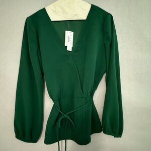 Brand New Green peplum Top. Size S